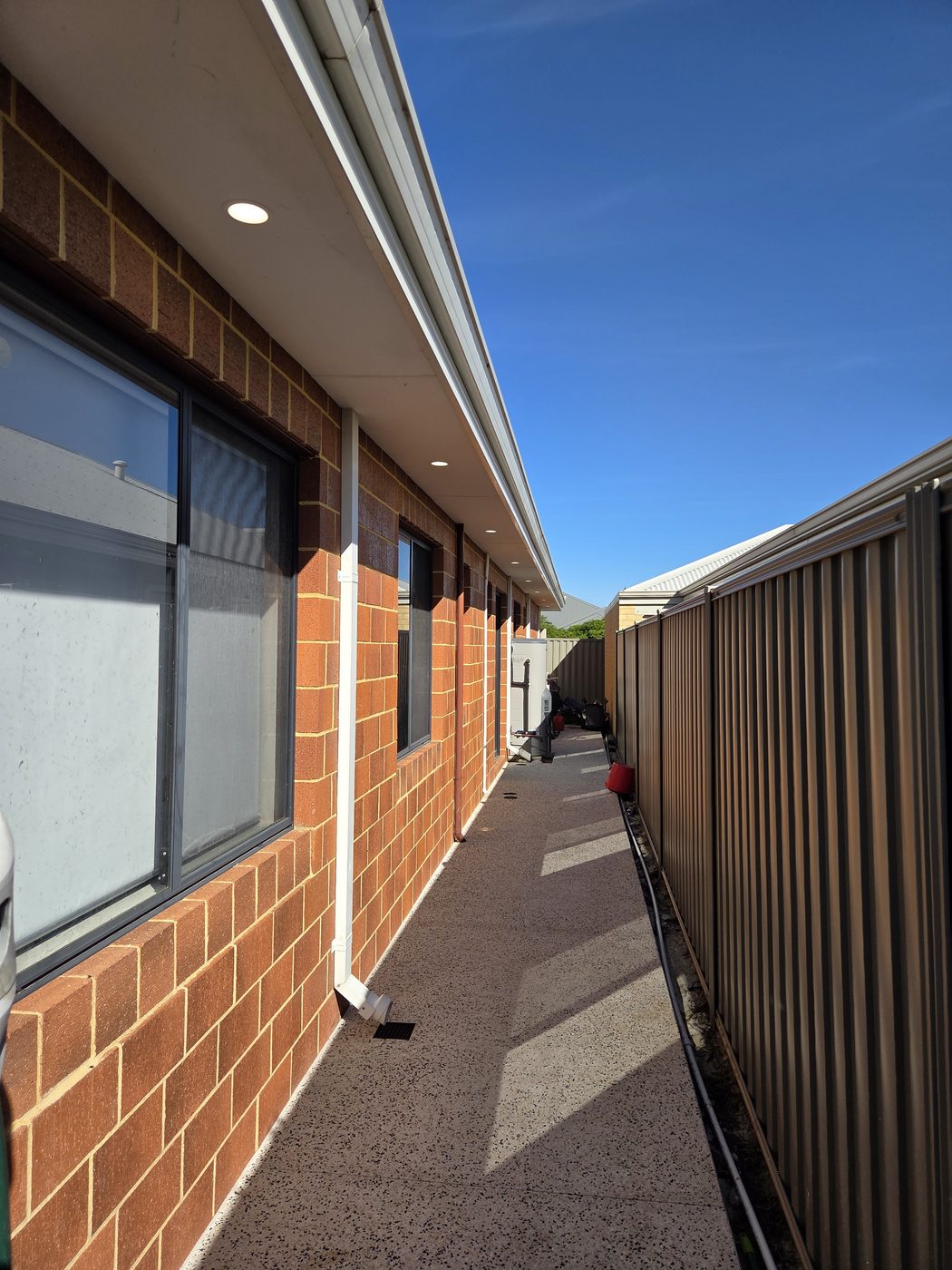 Eave down lights installed at a residential property
